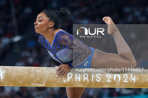 Simone Biles of Team United States competes on the balance beam during the Artistic Gymnastics Women's All-Around Final on day six of the Ol...