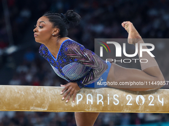 Simone Biles of Team United States competes on the balance beam during the Artistic Gymnastics Women's All-Around Final on day six of the Ol...