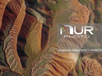 Colorful mountains are being seen on the 147 county road in Changji Hui Autonomous Prefecture, Xinjiang province, China, on July 25, 2024. (