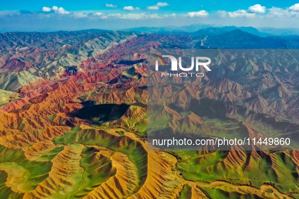 Colorful mountains are being seen on the 147 county road in Changji Hui Autonomous Prefecture, Xinjiang province, China, on July 25, 2024. 