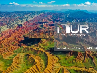 Colorful mountains are being seen on the 147 county road in Changji Hui Autonomous Prefecture, Xinjiang province, China, on July 25, 2024. (