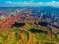 Colorful mountains are being seen on the 147 county road in Changji Hui Autonomous Prefecture, Xinjiang province, China, on July 25, 2024. (