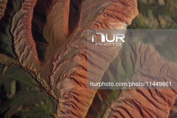 Colorful mountains are being seen on the 147 county road in Changji Hui Autonomous Prefecture, Xinjiang province, China, on July 25, 2024. 