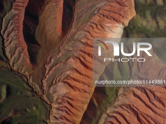 Colorful mountains are being seen on the 147 county road in Changji Hui Autonomous Prefecture, Xinjiang province, China, on July 25, 2024. (