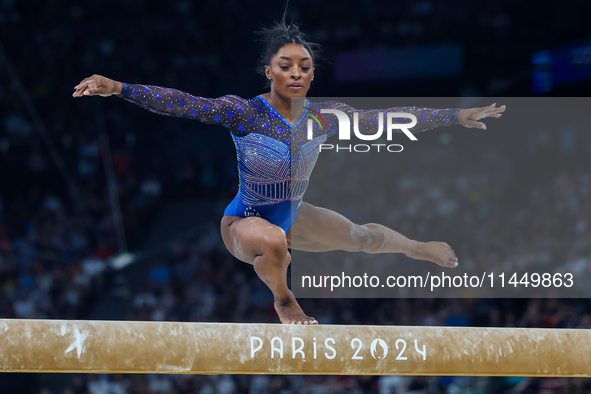 Simone Biles of Team United States competes on the balance beam during the Artistic Gymnastics Women's All-Around Final on day six of the Ol...