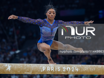 Simone Biles of Team United States competes on the balance beam during the Artistic Gymnastics Women's All-Around Final on day six of the Ol...