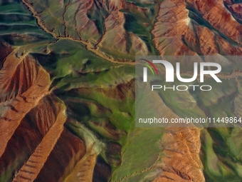 Colorful mountains are being seen on the 147 county road in Changji Hui Autonomous Prefecture, Xinjiang province, China, on July 25, 2024. (