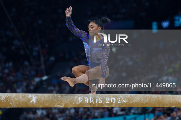 Simone Biles of Team United States competes on the balance beam during the Artistic Gymnastics Women's All-Around Final on day six of the Ol...