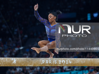 Simone Biles of Team United States competes on the balance beam during the Artistic Gymnastics Women's All-Around Final on day six of the Ol...