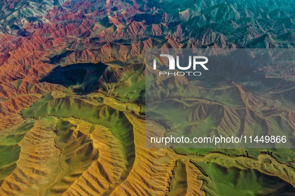 Colorful mountains are being seen on the 147 county road in Changji Hui Autonomous Prefecture, Xinjiang province, China, on July 25, 2024. 