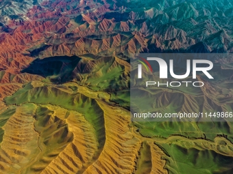 Colorful mountains are being seen on the 147 county road in Changji Hui Autonomous Prefecture, Xinjiang province, China, on July 25, 2024. (