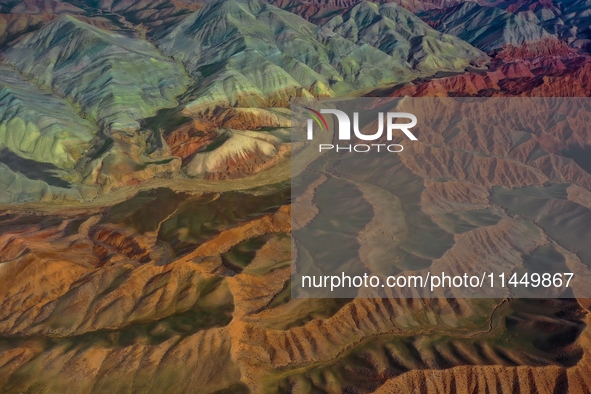 Colorful mountains are being seen on the 147 county road in Changji Hui Autonomous Prefecture, Xinjiang province, China, on July 25, 2024. 