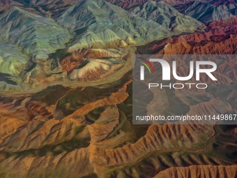 Colorful mountains are being seen on the 147 county road in Changji Hui Autonomous Prefecture, Xinjiang province, China, on July 25, 2024. (