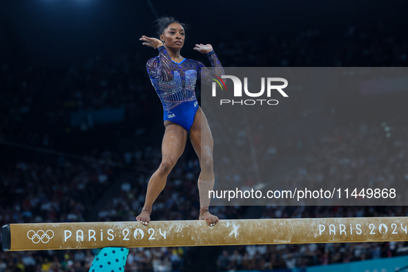 Simone Biles of Team United States competes on the balance beam during the Artistic Gymnastics Women's All-Around Final on day six of the Ol...