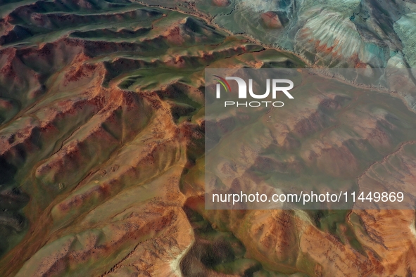 Colorful mountains are being seen on the 147 county road in Changji Hui Autonomous Prefecture, Xinjiang province, China, on July 25, 2024. 