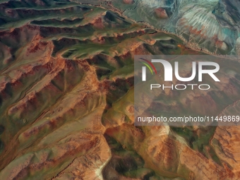 Colorful mountains are being seen on the 147 county road in Changji Hui Autonomous Prefecture, Xinjiang province, China, on July 25, 2024. (