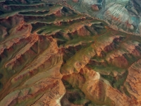 Colorful mountains are being seen on the 147 county road in Changji Hui Autonomous Prefecture, Xinjiang province, China, on July 25, 2024. (