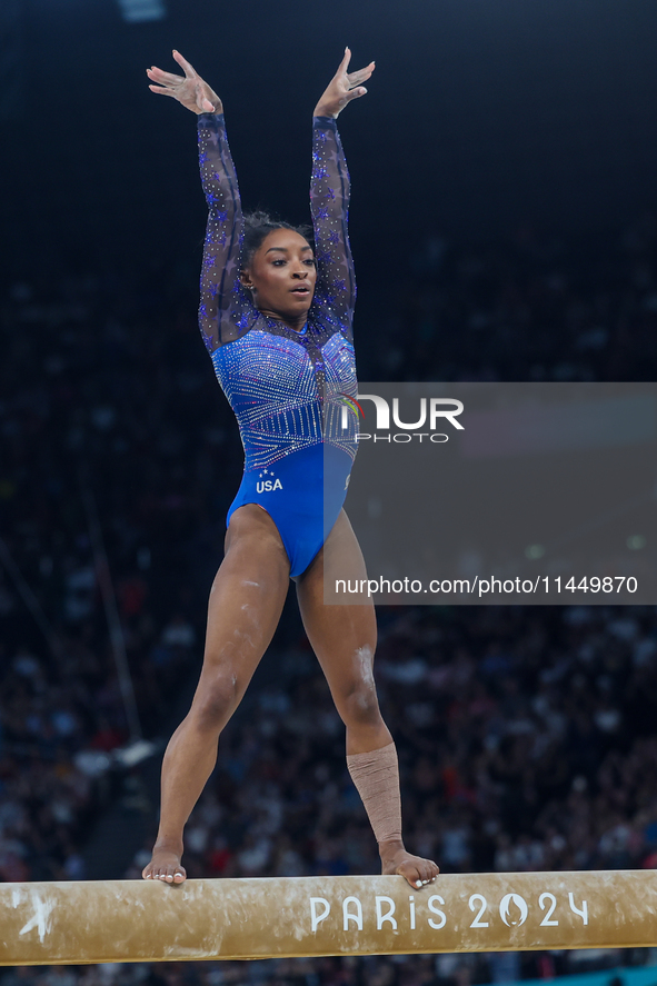 Simone Biles of Team United States competes on the balance beam during the Artistic Gymnastics Women's All-Around Final on day six of the Ol...