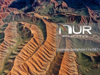 Colorful mountains are being seen on the 147 county road in Changji Hui Autonomous Prefecture, Xinjiang province, China, on July 25, 2024. (