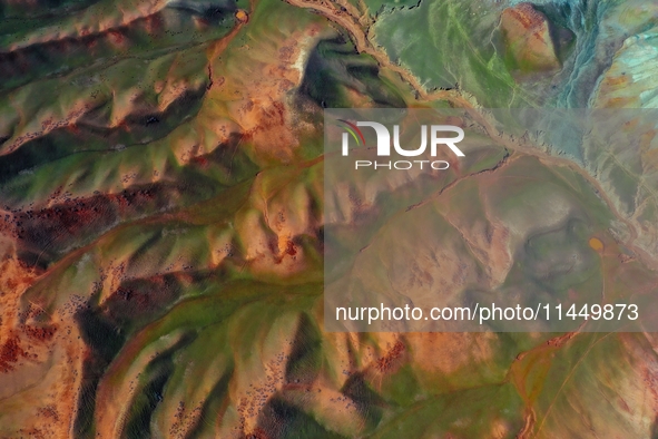 Colorful mountains are being seen on the 147 county road in Changji Hui Autonomous Prefecture, Xinjiang province, China, on July 25, 2024. 