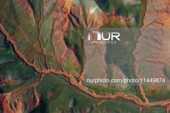 Colorful mountains are being seen on the 147 county road in Changji Hui Autonomous Prefecture, Xinjiang province, China, on July 25, 2024. 