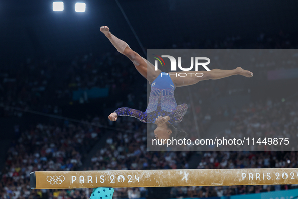 Simone Biles of Team United States competes on the balance beam during the Artistic Gymnastics Women's All-Around Final on day six of the Ol...