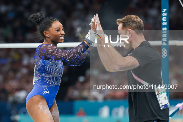 Simone Biles of United States performing on the Uneven Bars during  the Artistic Gymnastics Women's All-Around Final on day six of the Olymp...