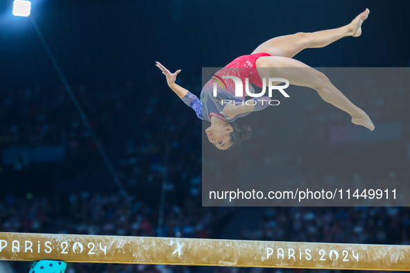 Sunisa Lee of Team United States competes on the balance beam during the Artistic Gymnastics Women's All-Around Final on day six of the Olym...