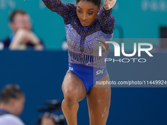 Simone Biles of Team United States competes in the floor exercise during the Artistic Gymnastics Women's All-Around Final on day six of the...