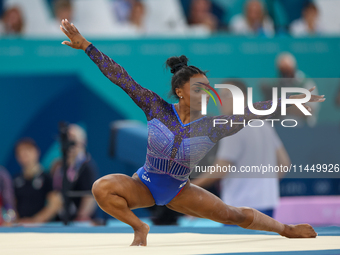 Simone Biles of Team United States competes in the floor exercise during the Artistic Gymnastics Women's All-Around Final on day six of the...