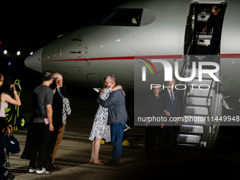 Freed prisoner Paul Whelan greets a family member after arriving at Joint Base Andrews on August 1, 2024 at Joint Base Andrews, Maryland. Th...