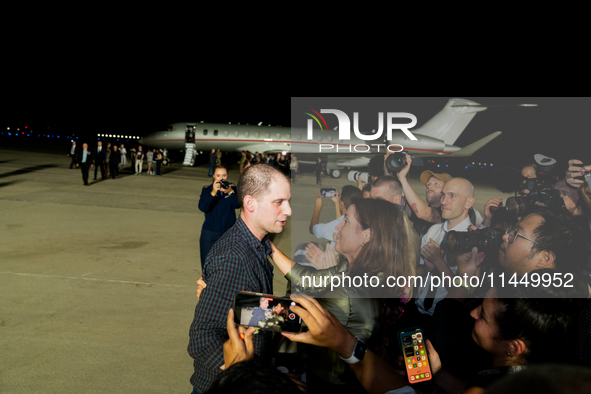 Freed prisoner Evan Gershkovich walks off a plane after he arrived at Joint Base Andrews on August 1, 2024 at Joint Base Andrews, Maryland....