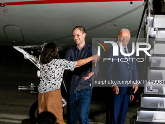 Evan Gershkovich greets his mother Ella Milman after arriving back in the United States on August 1, 2024 at Joint Base Andrews, Maryland. T...