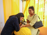 Nepali Hindu women are painting their palms with Heena, commonly called ''mehendi,'' at a fair in Kathmandu, Nepal, on August 2, 2024, as pa...