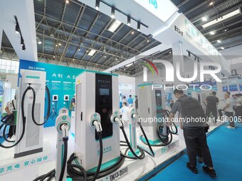 Visitors are visiting a ''smart charging pile'' at the 13th Beijing International Automobile Manufacturing Expo 2024 in Beijing, China, on A...