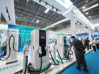 Visitors are visiting a ''smart charging pile'' at the 13th Beijing International Automobile Manufacturing Expo 2024 in Beijing, China, on A...