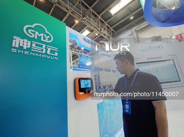 Visitors are experiencing a ''smart battery car charging pile'' at the 13th Beijing International Automobile Manufacturing Expo 2024 in Beij...