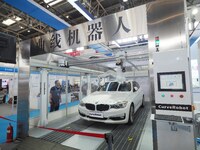 Visitors are visiting a ''curved plate spraying robot'' at the 13th Beijing International Automobile Manufacturing Expo 2024 in Beijing, Chi...