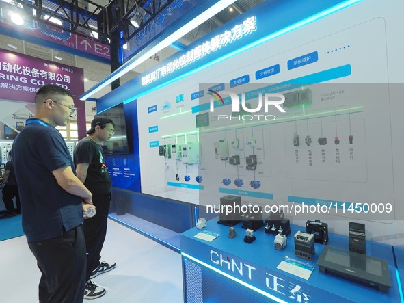 Visitors are visiting the ''Smart Factory Automation Control Total Solution'' at the 13th Beijing International Automobile Manufacturing Exp...