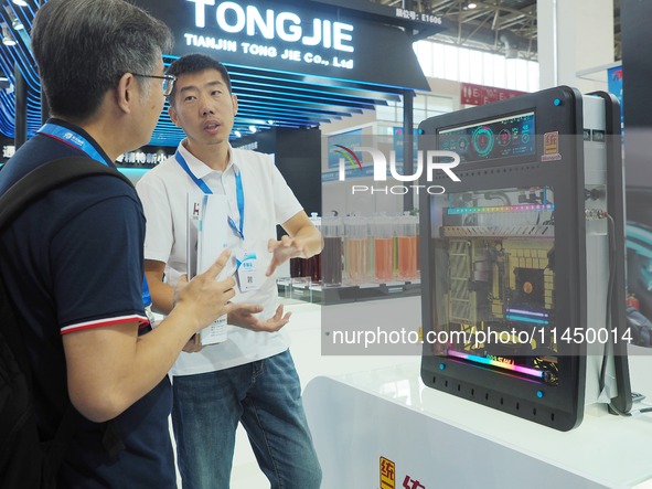 Visitors are visiting the ''New energy charging pile immersed thermal management fluid'' at the 13th Beijing International Automobile Manufa...