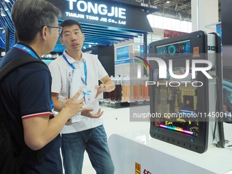 Visitors are visiting the ''New energy charging pile immersed thermal management fluid'' at the 13th Beijing International Automobile Manufa...