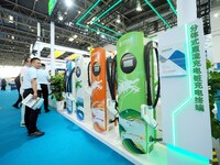 Visitors are visiting a ''split DC charging pile'' at the 13th Beijing International Automobile Manufacturing Expo 2024 in Beijing, China, o...