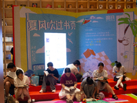 People are resting on the floor at a bookstore in Shanghai, China, on August 2, 2024, as high temperatures are persisting for the upcoming d...