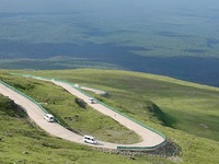 Tourists are taking a ferry bus to visit Tianchi Lake on the main peak of Changbai Mountain in Changbai Mountain, Northeast China's Jilin pr...