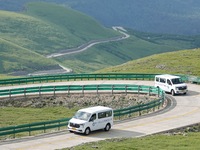 Tourists are taking a ferry bus to visit Tianchi Lake on the main peak of Changbai Mountain in Changbai Mountain, Northeast China's Jilin pr...