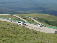 Tourists are taking a ferry bus to visit Tianchi Lake on the main peak of Changbai Mountain in Changbai Mountain, Northeast China's Jilin pr...