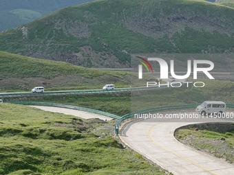 Tourists are taking a ferry bus to visit Tianchi Lake on the main peak of Changbai Mountain in Changbai Mountain, Northeast China's Jilin pr...