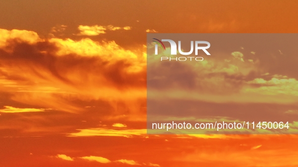 Colorful fire clouds are appearing on the Gobi Beach in Hami, Xinjiang province, China, on August 1, 2024. 