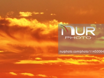 Colorful fire clouds are appearing on the Gobi Beach in Hami, Xinjiang province, China, on August 1, 2024. (