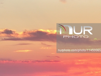 Colorful fire clouds are appearing on the Gobi Beach in Hami, Xinjiang province, China, on August 1, 2024. (